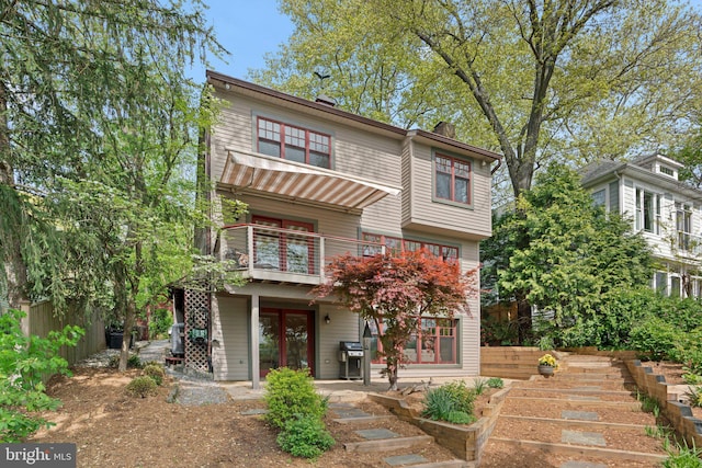 735 Dividing Rd, Severna Park, MD 21146 - back of house with a patio, a balcony, a chimney, french doors, and fence