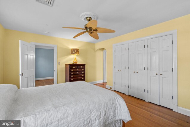 65 W Green St, Westminster, MD 21157 - bedroom with arched walkways, baseboards, visible vents, and wood finished floors