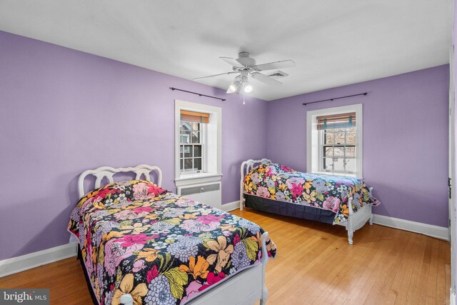 65 W Green St, Westminster, MD 21157 - bedroom with baseboards, ceiling fan, wood finished floors, and visible vents