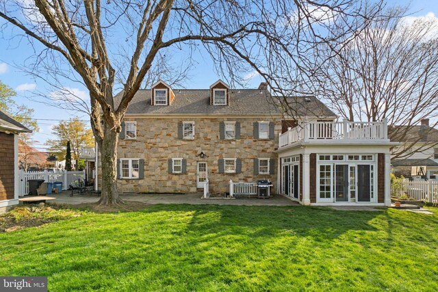 65 W Green St, Westminster, MD 21157 - rear view of property featuring a patio area, fence, a balcony, a yard, and stone siding