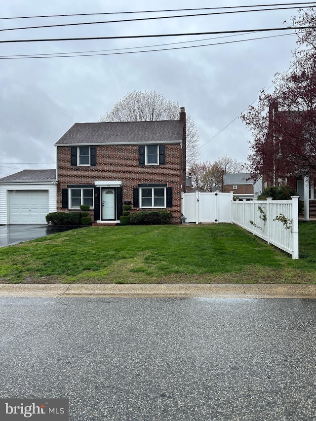 112 Jackson Ave, New Castle, DE 19720 - view of front of property featuring a chimney, fence, brick siding, a front lawn, and a garage