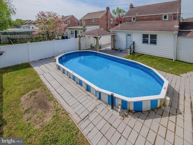 112 Jackson Ave, New Castle, DE 19720 - view of swimming pool featuring a residential view, a fenced in pool, a gazebo, a patio area, and a fenced backyard