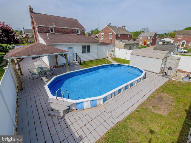 112 Jackson Ave, New Castle, DE 19720 - view of pool with an outdoor structure, a residential view, a fenced in pool, a fenced backyard, and a storage shed