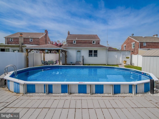 112 Jackson Ave, New Castle, DE 19720 - view of pool featuring an outdoor structure, a fenced in pool, a gazebo, a storage shed, and a fenced backyard