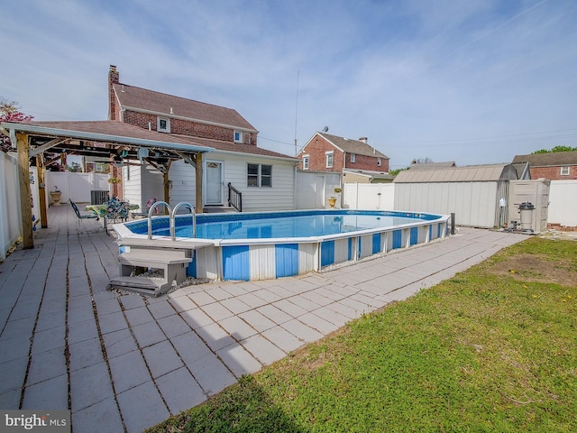112 Jackson Ave, New Castle, DE 19720 - view of pool featuring a fenced in pool, a gazebo, a patio area, an outbuilding, and a fenced backyard