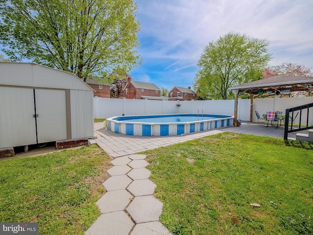 112 Jackson Ave, New Castle, DE 19720 - view of swimming pool featuring a yard, a shed, a gazebo, and a fenced backyard