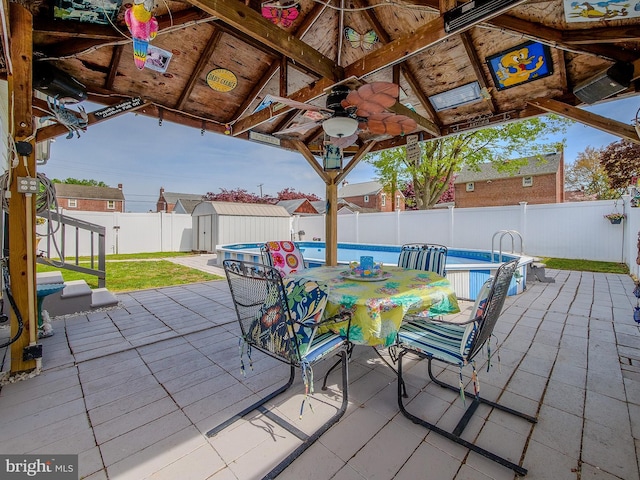 112 Jackson Ave, New Castle, DE 19720 - view of patio featuring a gazebo, a fenced backyard, a ceiling fan, and a storage shed
