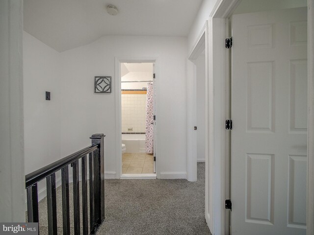112 Jackson Ave, New Castle, DE 19720 - hall featuring an upstairs landing, baseboards, lofted ceiling, and carpet floors