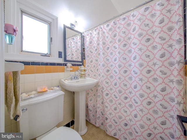 112 Jackson Ave, New Castle, DE 19720 - bathroom with tile patterned flooring, a shower with curtain, tile walls, a wainscoted wall, and toilet