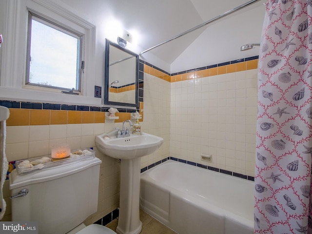 112 Jackson Ave, New Castle, DE 19720 - full bathroom with toilet, tile walls, shower / bathtub combination with curtain, and tile patterned flooring