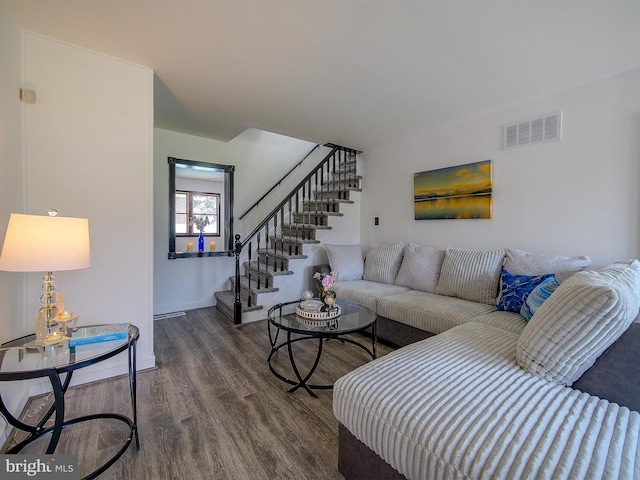 112 Jackson Ave, New Castle, DE 19720 - living room with baseboards, visible vents, wood finished floors, and stairs
