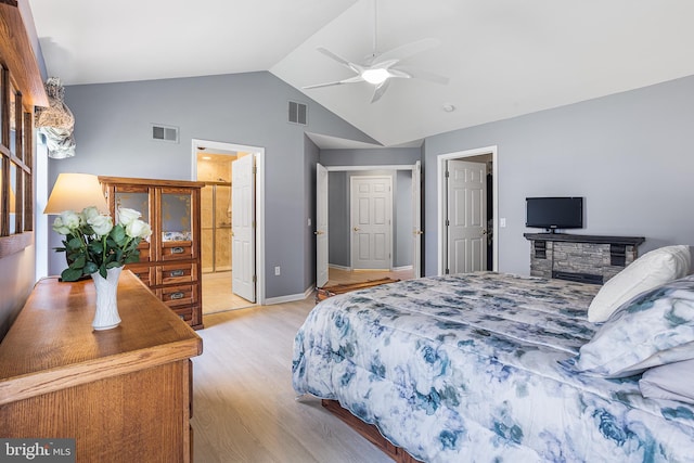 bedroom with light wood finished floors, a ceiling fan, visible vents, and high vaulted ceiling