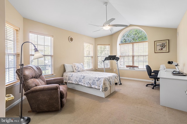 bedroom featuring light carpet, lofted ceiling, multiple windows, and baseboards