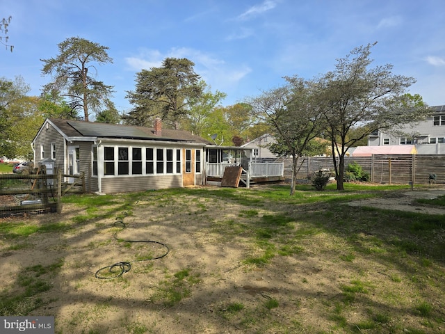 401 Timberline Dr, Mount Laurel, NJ 08054 - rear view of property featuring a sunroom, a wooden deck, and a chimney