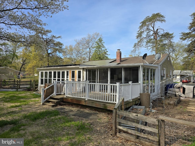 401 Timberline Dr, Mount Laurel, NJ 08054 - back of property with a sunroom, a chimney, a wooden deck, and a shingled roof