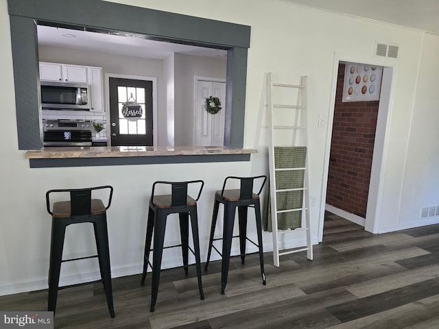401 Timberline Dr, Mount Laurel, NJ 08054 - kitchen featuring appliances with stainless steel finishes, dark wood-style flooring, white cabinetry, and baseboards