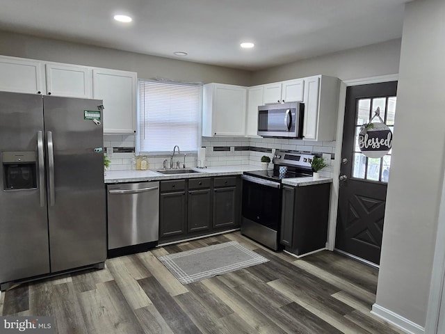 401 Timberline Dr, Mount Laurel, NJ 08054 - kitchen with stainless steel appliances, a sink, white cabinetry, backsplash, and recessed lighting