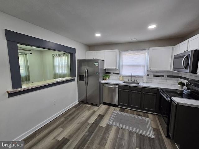 401 Timberline Dr, Mount Laurel, NJ 08054 - kitchen with appliances with stainless steel finishes, a sink, white cabinets, tasteful backsplash, and recessed lighting