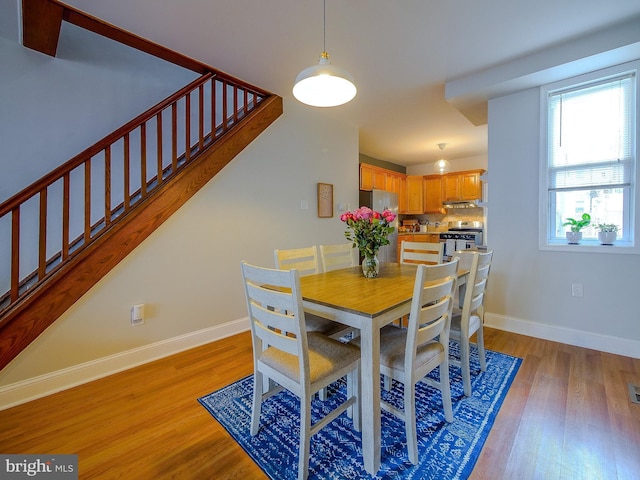 2905 Memphis St, Philadelphia, PA 19134 - dining space with stairway, baseboards, and light wood-style floors