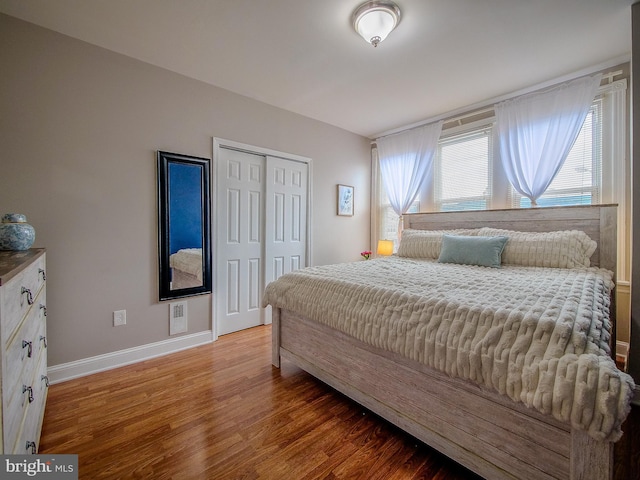 2905 Memphis St, Philadelphia, PA 19134 - bedroom with baseboards, wood finished floors, and a closet