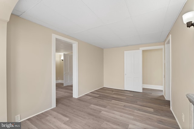 35 Walnut St, Salem, NJ 08079 - unfurnished bedroom with a drop ceiling, wood finished floors, and baseboards