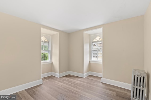 35 Walnut St, Salem, NJ 08079 - empty room featuring radiator, baseboards, and wood finished floors