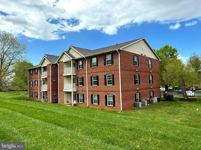 view of building exterior featuring central AC