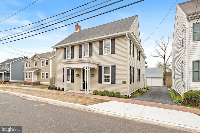 442 Ellisdale Rd, Crosswicks, NJ 08515 - colonial inspired home with a chimney, a shingled roof, and an outdoor structure
