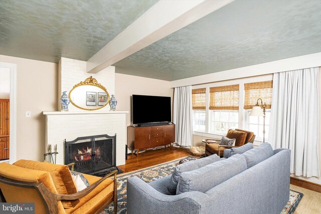 442 Ellisdale Rd, Crosswicks, NJ 08515 - living area with wood finished floors, a fireplace, and beam ceiling