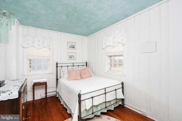 442 Ellisdale Rd, Crosswicks, NJ 08515 - bedroom with a baseboard heating unit, dark wood-style floors, a textured ceiling, and crown molding