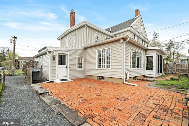 442 Ellisdale Rd, Crosswicks, NJ 08515 - back of property featuring a patio area, fence, and a chimney