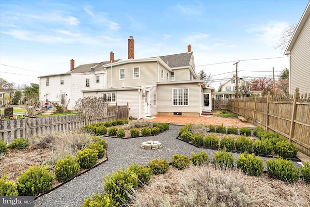442 Ellisdale Rd, Crosswicks, NJ 08515 - back of property with entry steps, a chimney, a fenced backyard, and a patio