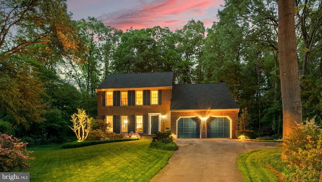 116 Amesbury Ct, Severna Park, MD 21146 - view of front facade featuring asphalt driveway, an attached garage, brick siding, and a yard
