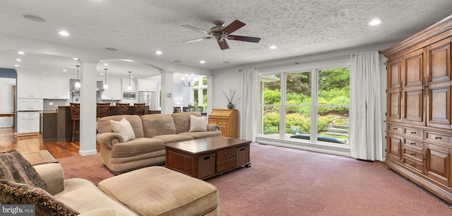 116 Amesbury Ct, Severna Park, MD 21146 - living room featuring ornate columns, a ceiling fan, recessed lighting, and a textured ceiling