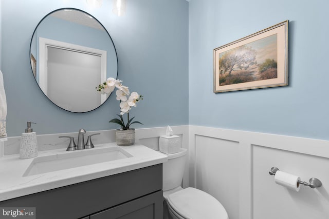 116 Amesbury Ct, Severna Park, MD 21146 - half bathroom featuring a wainscoted wall, toilet, and vanity