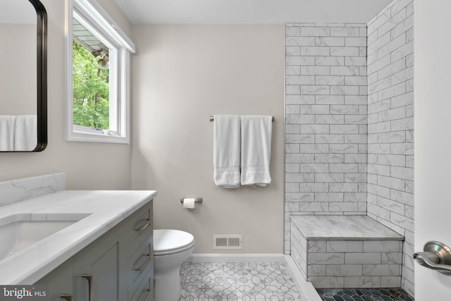 116 Amesbury Ct, Severna Park, MD 21146 - full bath featuring vanity, tiled shower, toilet, baseboards, and tile patterned floors