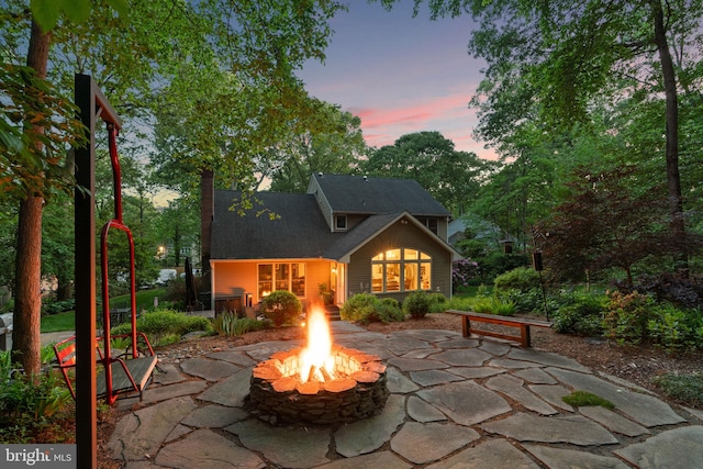 116 Amesbury Ct, Severna Park, MD 21146 - patio terrace at dusk with an outdoor fire pit and a patio area