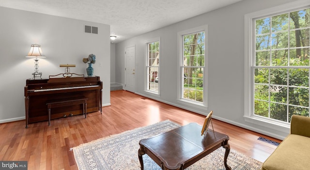 116 Amesbury Ct, Severna Park, MD 21146 - living area featuring wood finished floors, a textured ceiling, and baseboards