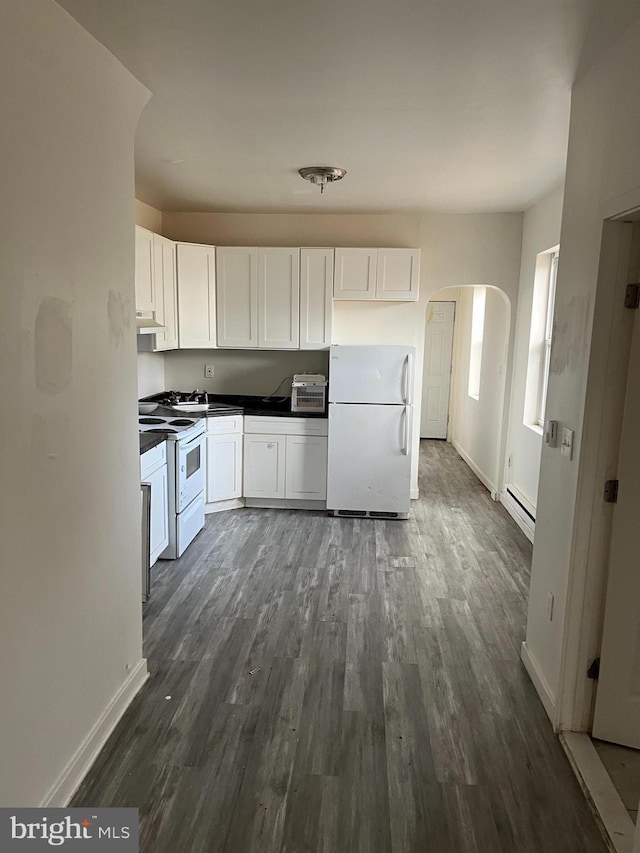 kitchen with white cabinetry, a baseboard radiator, baseboards, dark wood-style flooring, and white appliances