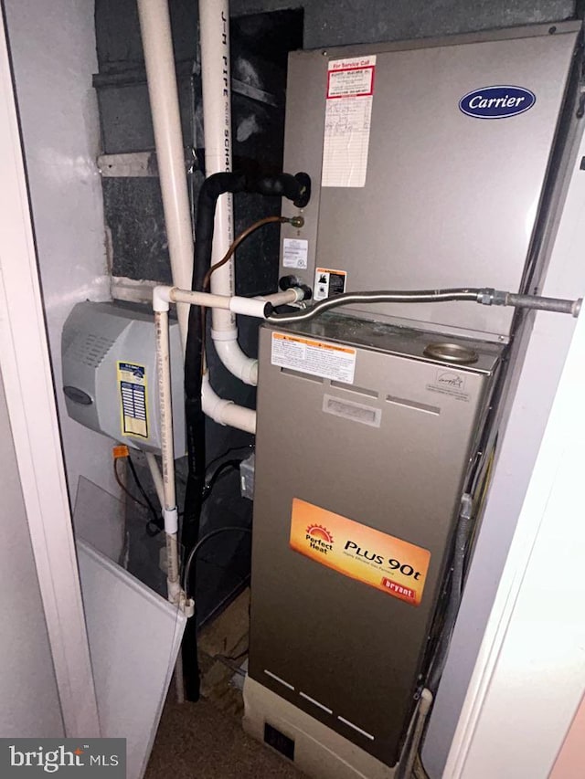 utility room with heating unit