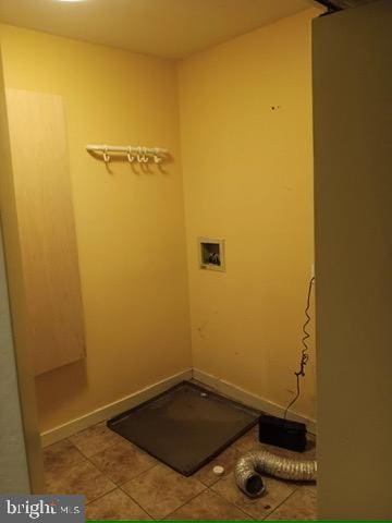 clothes washing area with laundry area, washer hookup, and tile patterned flooring