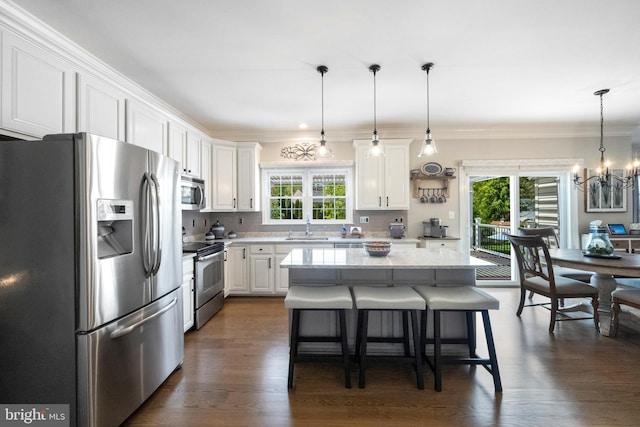 15014 Plastron Ct, Woodbridge, VA 22193 - kitchen featuring white cabinets, a healthy amount of sunlight, stainless steel appliances, and a sink