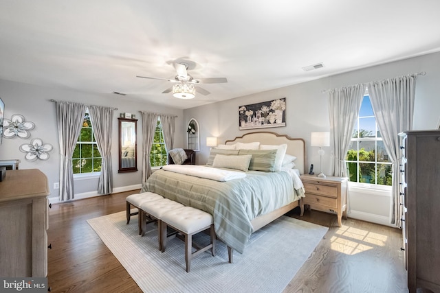 15014 Plastron Ct, Woodbridge, VA 22193 - bedroom with baseboards, a ceiling fan, wood finished floors, and visible vents
