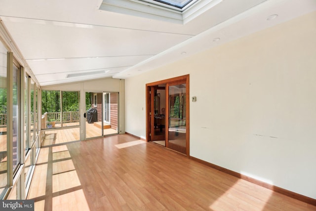 1326 Jones Station Rd, Arnold, MD 21012 - spare room featuring floor to ceiling windows, french doors, baseboards, lofted ceiling with skylight, and light wood-style flooring