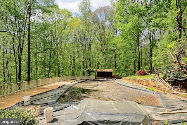 1326 Jones Station Rd, Arnold, MD 21012 - view of swimming pool featuring a deck, an outdoor structure, and a shed