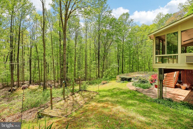 1326 Jones Station Rd, Arnold, MD 21012 - view of yard with a sunroom, a view of trees, and a patio area