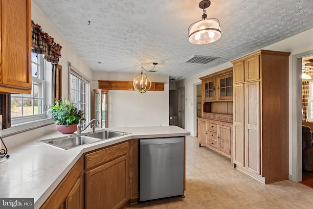 10257 Back Creek Valley Rd, Hedgesville, WV 25427 - kitchen with visible vents, stainless steel dishwasher, a sink, a peninsula, and brown cabinetry
