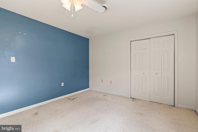 10257 Back Creek Valley Rd, Hedgesville, WV 25427 - unfurnished bedroom with a closet, carpet flooring, baseboards, and a ceiling fan