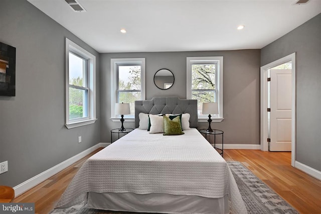 512 Peabody St NW, Washington, DC 20011 - bedroom with visible vents, baseboards, light wood-type flooring, and recessed lighting