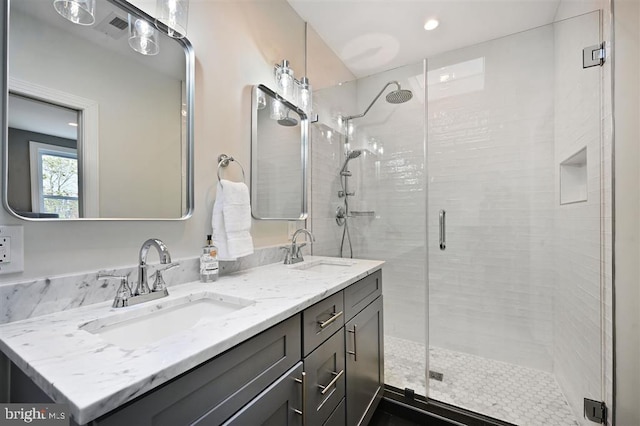512 Peabody St NW, Washington, DC 20011 - full bathroom featuring a sink, a shower stall, and double vanity
